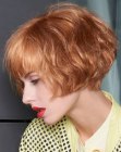 Short bob with bangs and 1980s inspired styling