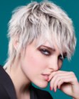 Short razored haircut with layers and mullet elements
