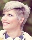 Short women's hair with grey sections and a sheared undercut