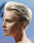 Modern effortless pixie cut with the hair styled towards the back