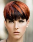Pixie cut with contrasting hair colors and a very short nape section