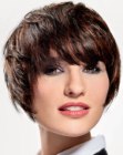 Classic short hairstyle with layers, tapered sides and long bangs