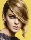 Short bob with layers and bangs that cover a part of the face