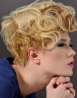 Hairstyle with a very short side and curls in the crown