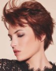 Feathery pixie cut with the bangs styled upwards