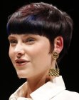 Pixie cut with blunt bangs and sideburns