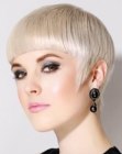 Pixie with arched bangs for shiny blonde hair
