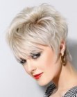 Blonde pixie hairstyle with length in the neck