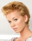 Elegant pixie cut with the hair combed to the back