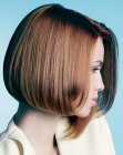 Brunette asymmetrical bob with one side curling inward