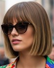 Blunt dark-blonde bob with bangs