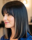 Straight dark brown shoulder-length hair with caramel highlights
