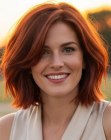 Red-toned above the shoulders bob