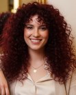 Long dark red hair with curls
