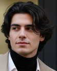 Man with tousled dark hair