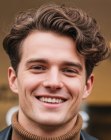 Man with short curly hair