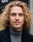 Man with long blonde curls