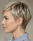 Blonde pixie cut with long bangs