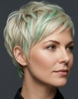 Blonde pixie cut with mint-green streaks