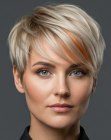 Blonde pixie cut with a copper accent