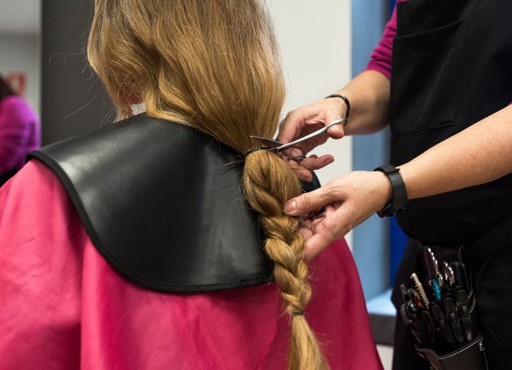 Woman getting her hair cut short