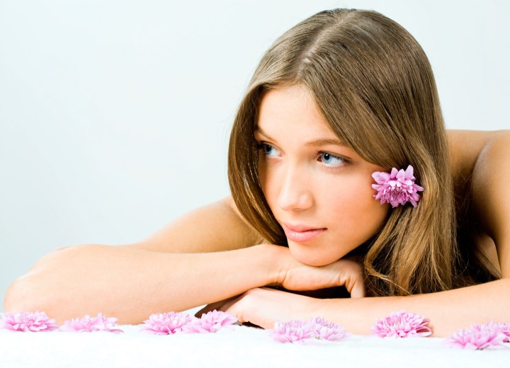 Girl who is wearing a flower in her hair