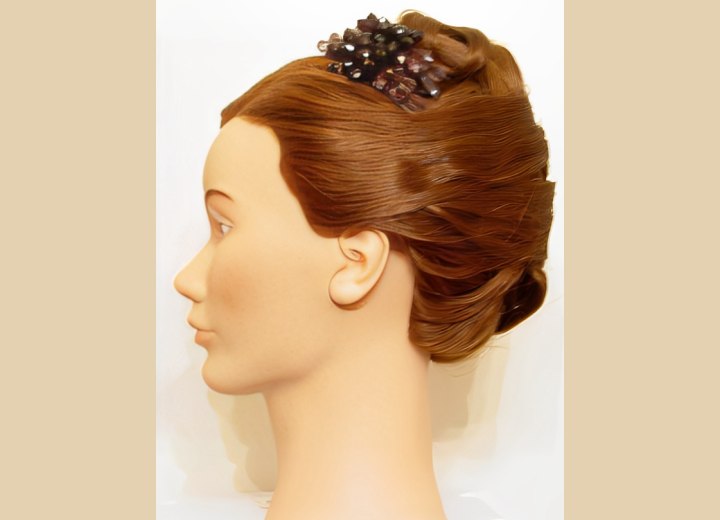 Hair styled in a smooth up-style with a jeweled comb