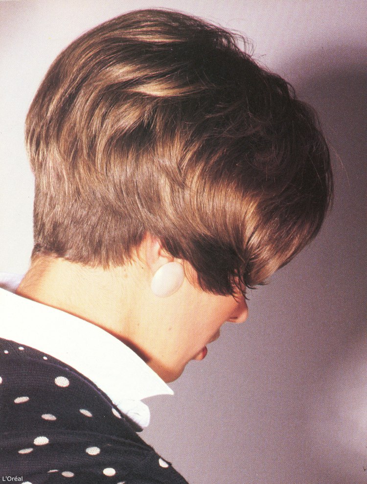 Short eighties hairstyle with the hair cut very short at the back