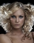 Full-volume hairstyle with springy curls