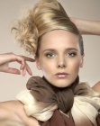 Blonde up-swept hair with an angled roll