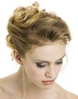 Romantic updo with playful curls and waves