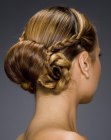 Updo with a nape-gathered knot featuring old fashion elements
