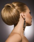 Up-style with sleek styling and an exaggerated chignon