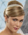 Glamorous up-style with a barrette on top of the head and one in the back