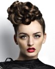 Updo with large curls and slick back and sides