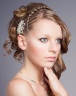 Romantic hairstyle with a French braid and a piece of hair jewelry