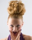 Pineapple shape updo with sleek sides