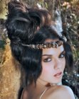 Hairdo with a fluffy chignon and a decorative headband