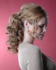 Festive hairstyle with a ponytail for naturally curly hair
