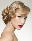 Hair styled up for a Rosemary Clooney look with a knot of soft curls