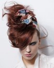 Updo with a knotted scarf wrapped around the head