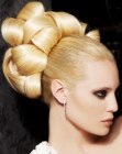Blonde hairstyle with a knotted chignon