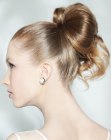 Up-style with a large bow and curling