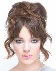 Updo with straight bangs and piled curls