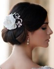Bridal style featuring a headpiece with a flower