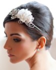 Wedding updo with a silken rose