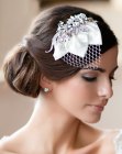 Chignon hairstyle and a headpiece with a veil