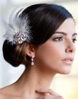 1920s hair and a headpiece with feathers