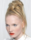 Partially braided up-style with a bun like structure