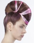 Futuristic updo with fuchsia color accents